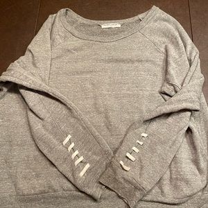 Project Social T grey sweatshirt with white laces on sleeves